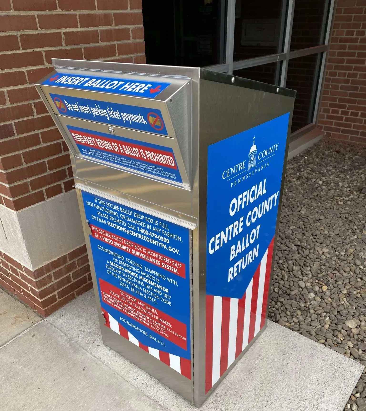 An official Centre County ballot return drop box outside a county building.